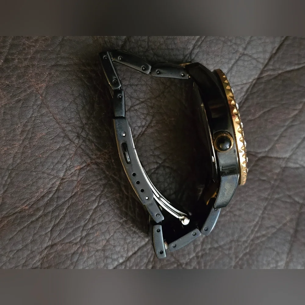 Marc Ecko womens E17536L1 black and gold‎ with gem accents. Stainless steel